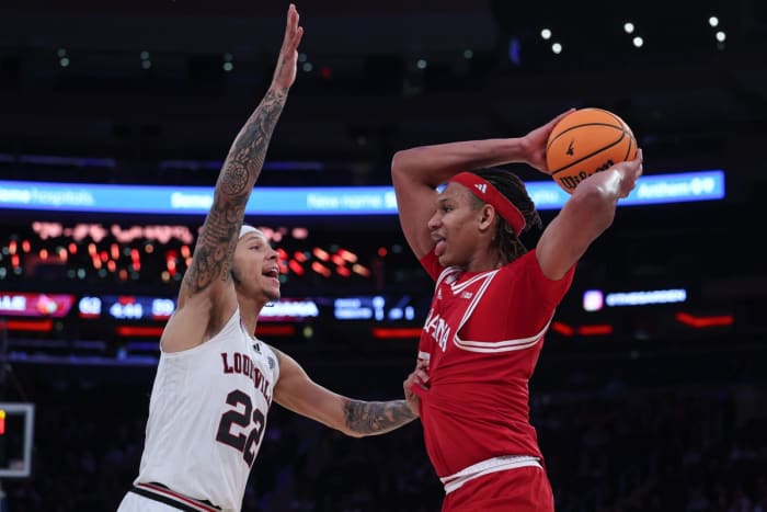 Indiana Hoosiers forward Malik Reneau (5) is guarded by Louisville Cardinals guard Tre White (22) during the second half at Madison Square Garden.